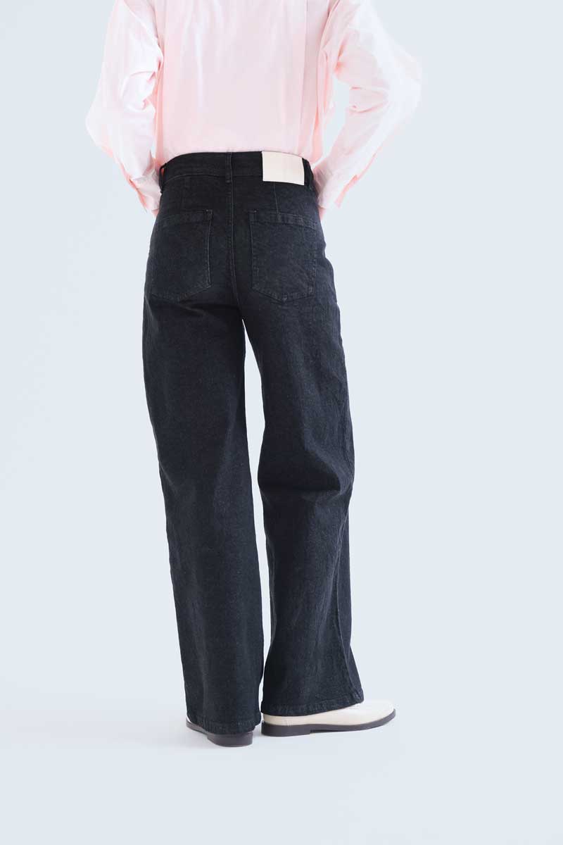 Black denim trousers with Candy print