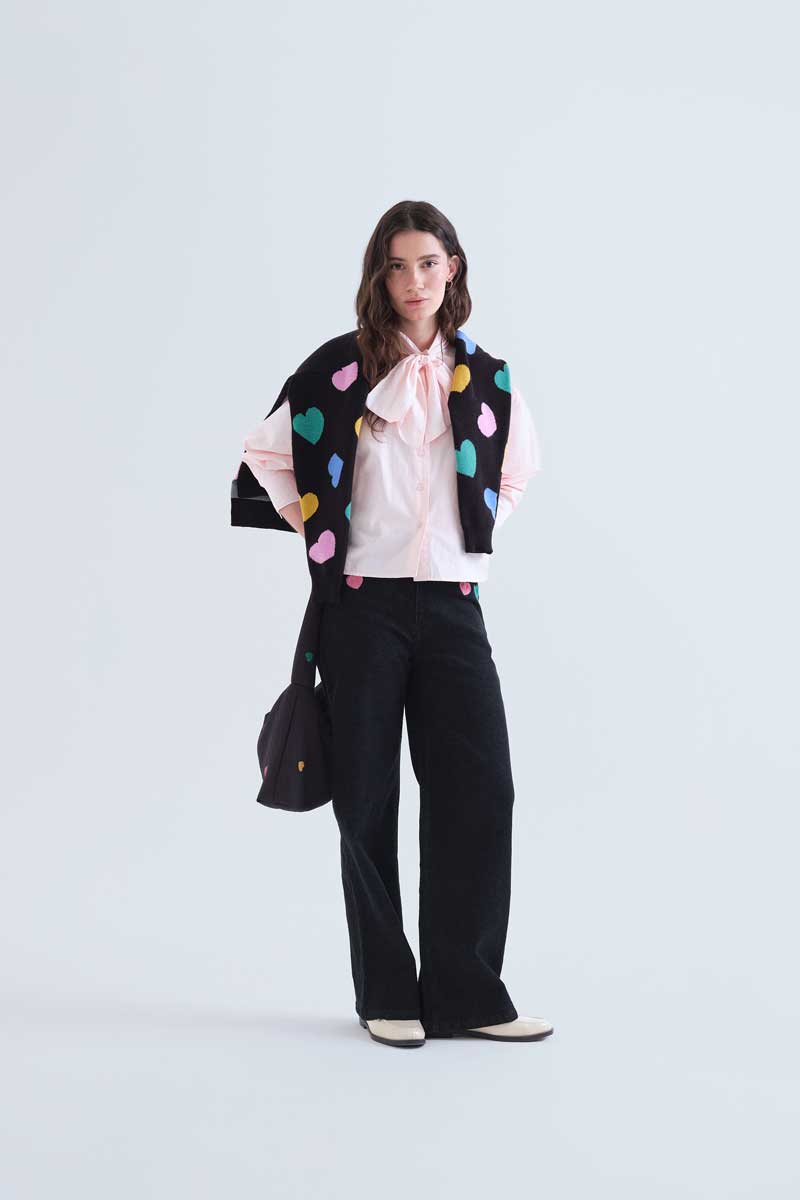 Black denim trousers with Candy print