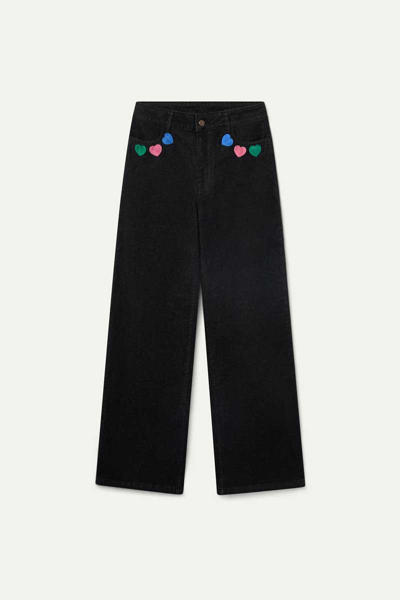 Black denim trousers with Candy print