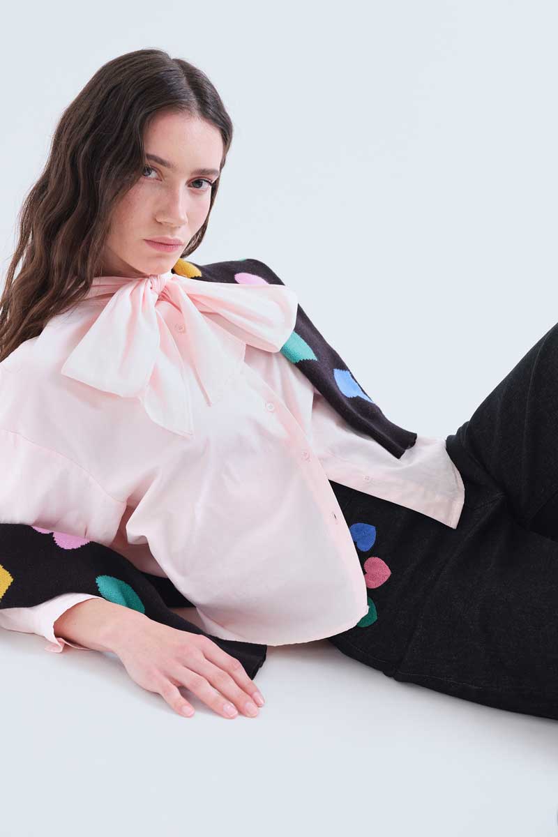 Black denim trousers with Candy print