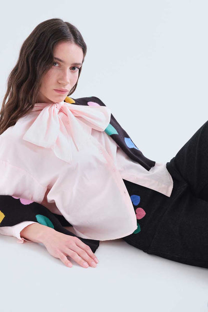 Black denim trousers with Candy print
