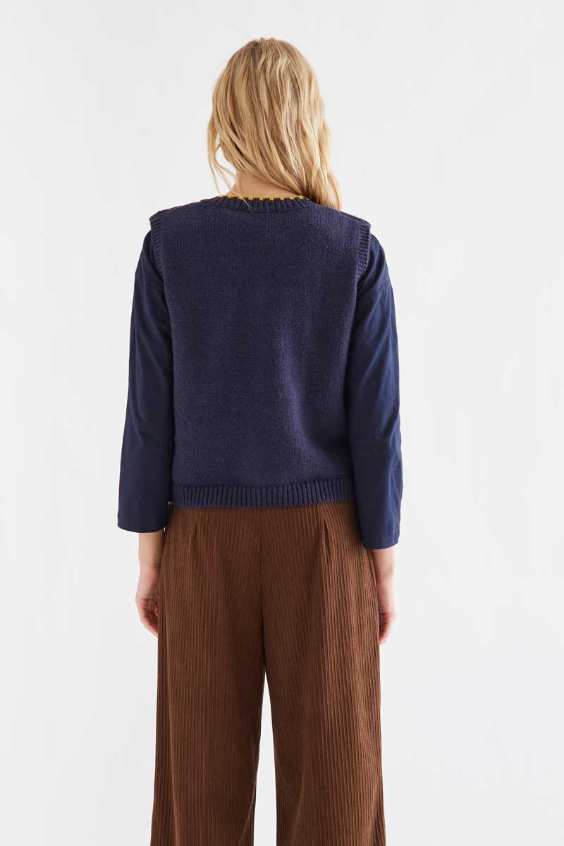 Navy blue knit vest with multicolored velvet buttons
