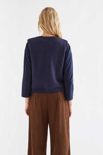 Navy blue knit vest with multicolored velvet buttons