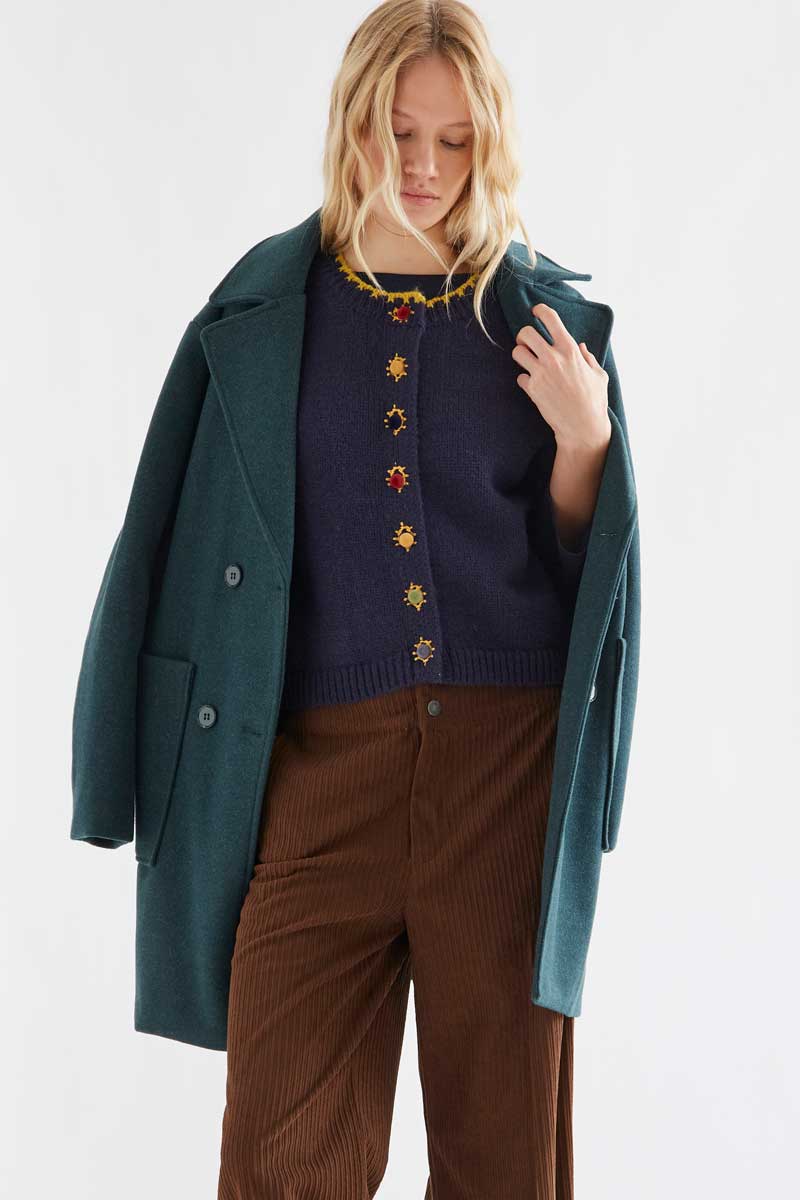 Navy blue knit vest with multicolored velvet buttons