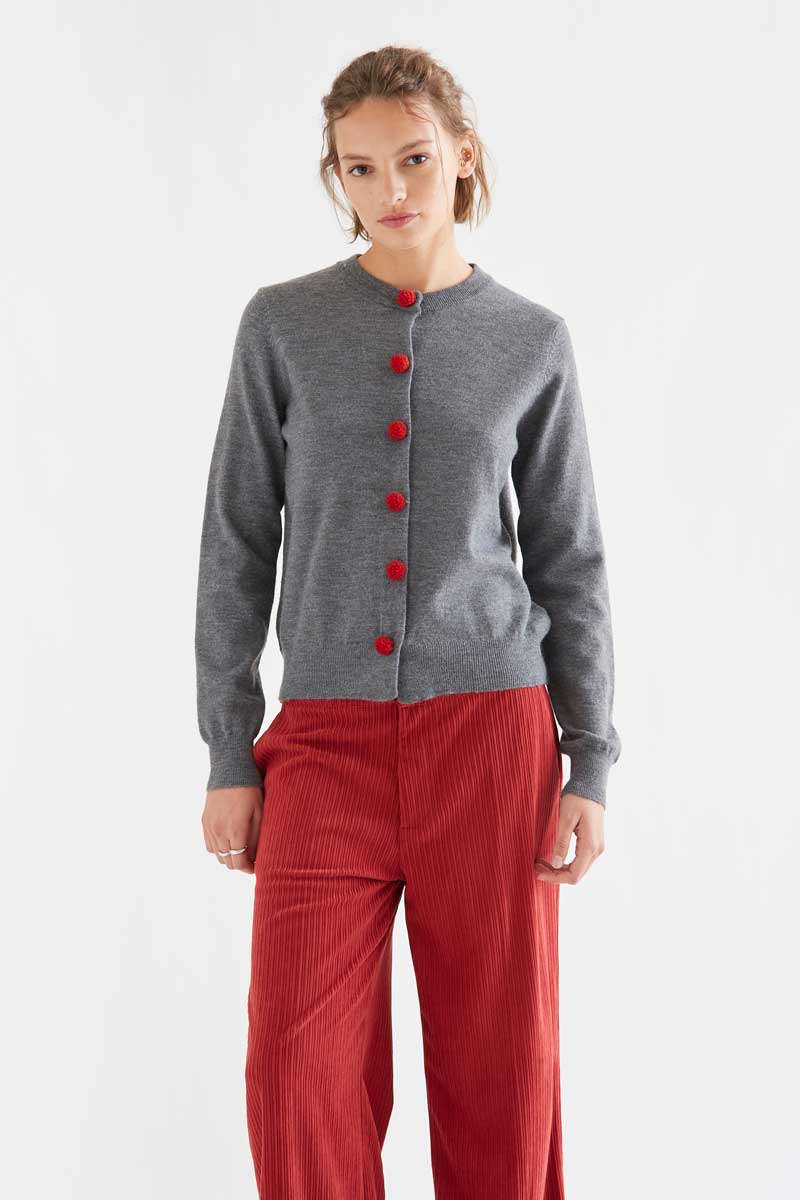 Grey cardigan with red pompoms