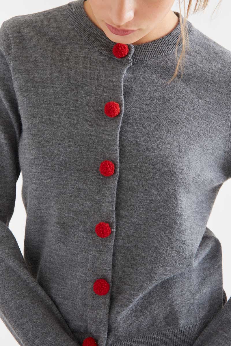 Grey cardigan with red pompoms