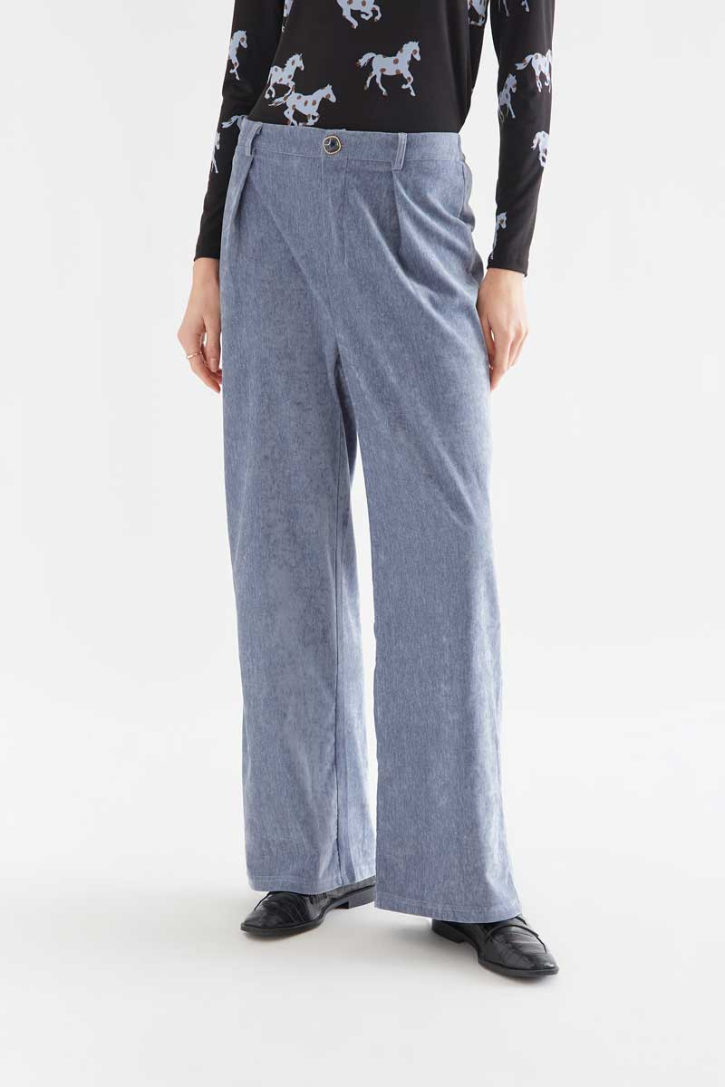 Light blue velvet trousers with jewel button