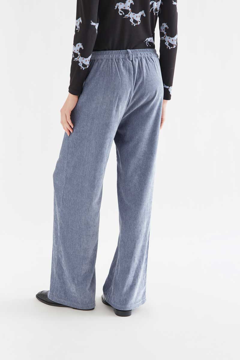 Light blue velvet trousers with jewel button