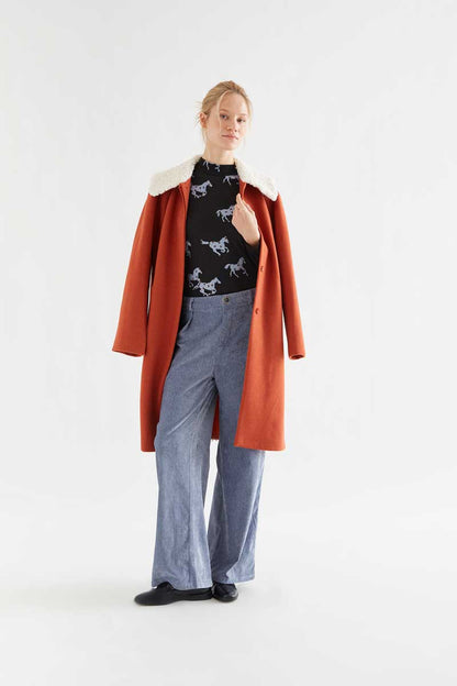 Light blue velvet trousers with jewel button