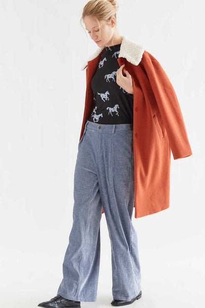 Light blue velvet trousers with jewel button