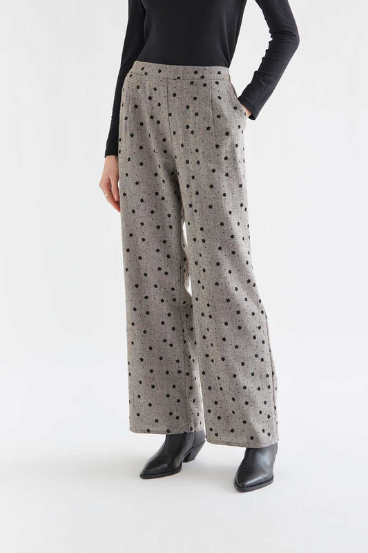 Gray tweed trousers with black embroidered flowers