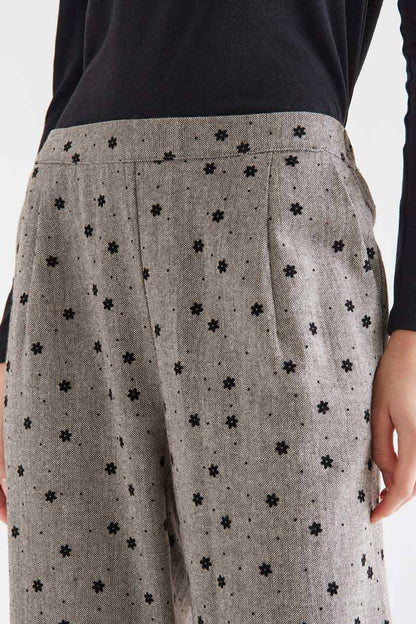 Gray tweed trousers with black embroidered flowers