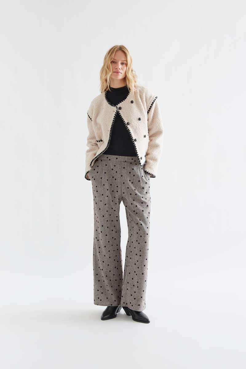 Gray tweed trousers with black embroidered flowers