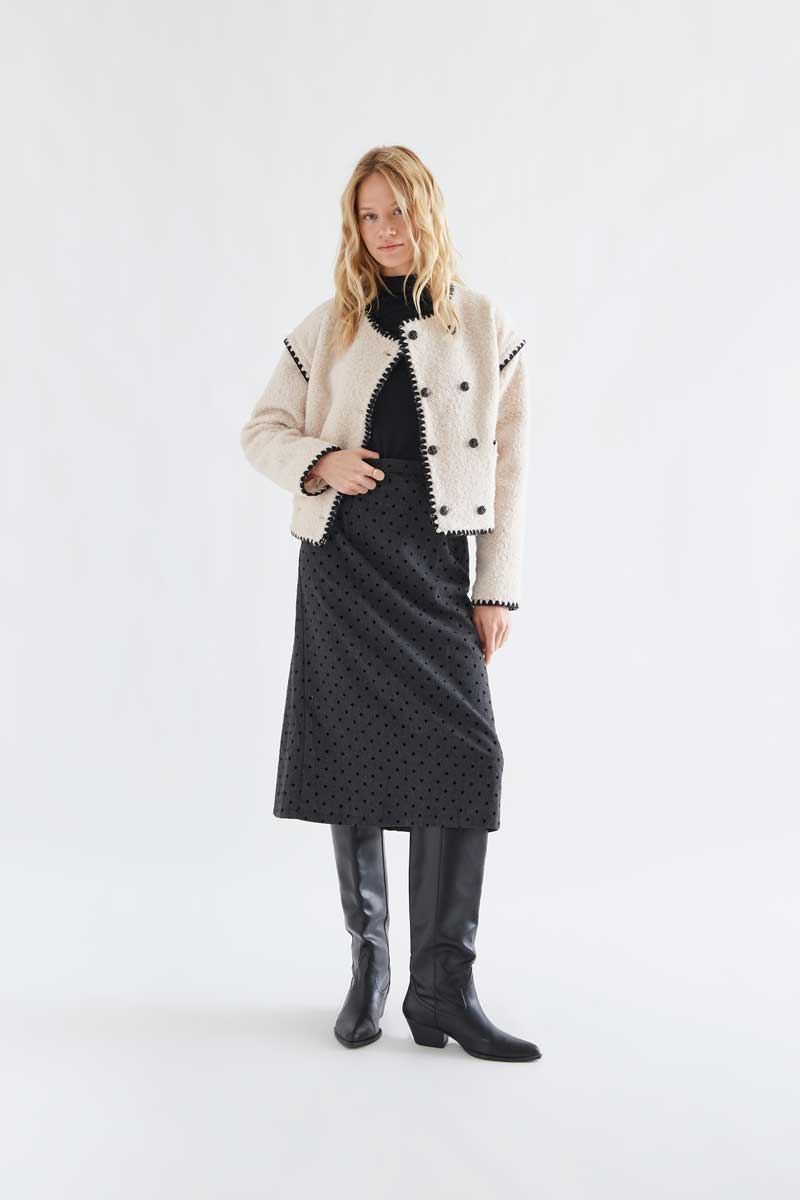 Off-white short faux shearling coat with black accents