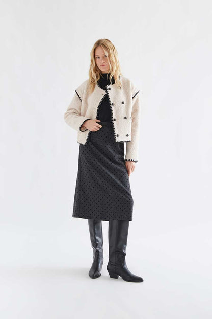 Off-white short faux shearling coat with black accents